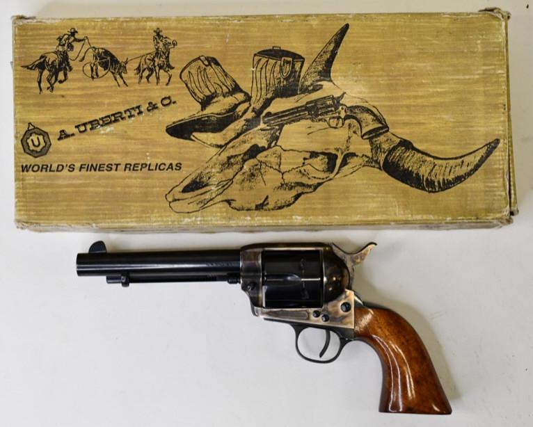 A. Uberti Brass Regulator .45 Cal Revolver in Box: Italian made A. Uberti Brass Regulator single action 6 shot revolver in .44 caliber. 5.5" barrel, blue finish, and in great condition in the original box with both .45 ACP and .45 Long Colt cylinders.