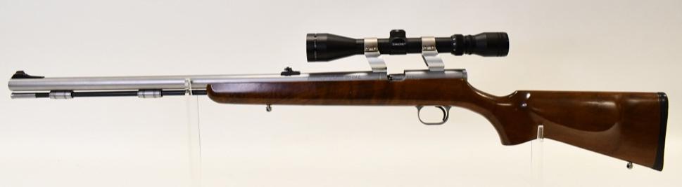 Thompson Center Arms Firehawk Black Powder Rifle: Nice Thompson Center Arms Firehawk Black Powder Rifle in .50 caliber. The rifle has a 24" round barrel and comes with the ramrod. Nice condition with some wear, comes with Simmons scope. SN:S1131.