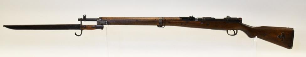 WWII Japanese Type 99 Arisaka Bolt Action Rifle: Japanese Arisaka T99 bolt action rifle in 7.75x58mm. The rifle has a 25.9" barrel, ground mum, and is in nice used condition. Made at the Nagayo Arsenal. Comes with a Japanese Type 30 Bayonet. SN:4650