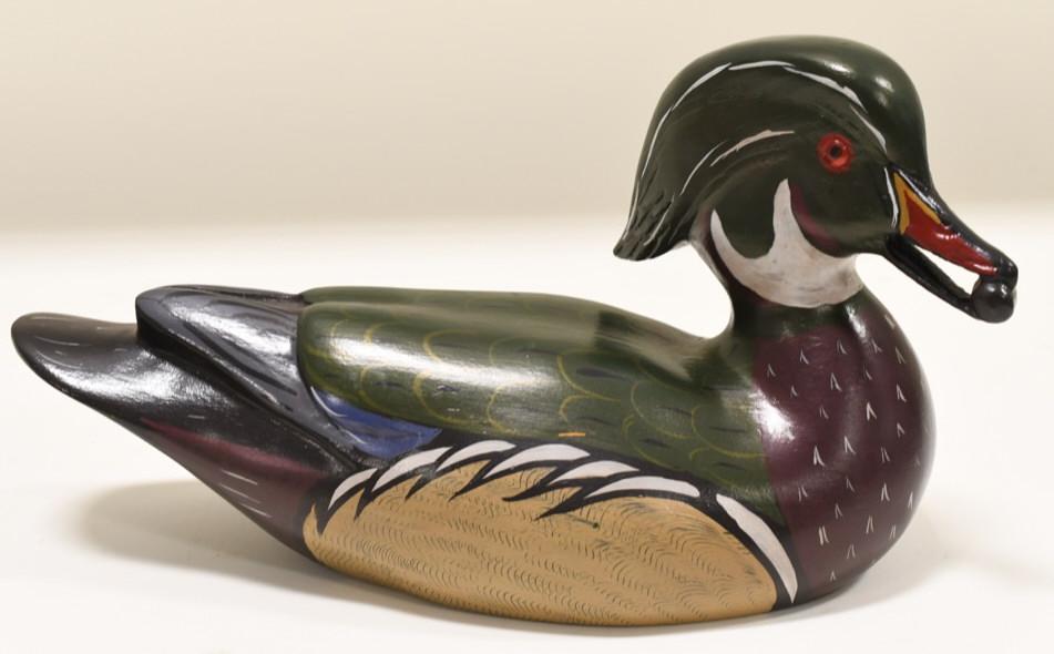 Charles "Chas" Moore Wood Duck Decoy DeKalb ILL: Wooden Wood Duck decoy by Dekalb, Illinois artist Charles Moore. Nice condition with light wear from age and display. Displays very well with glass eyes and nice detail.Measures approximately 13" acro