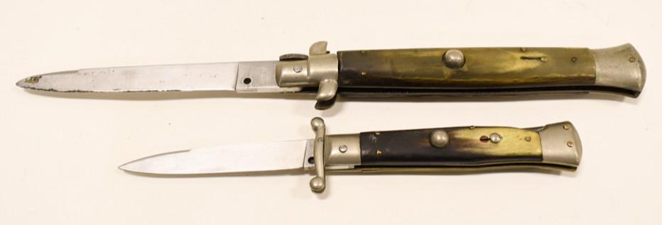(2) Vintage INOX Switchblade Folding Knives: Lot of two vintage INOX brand switchblade folding knives. Both knives have wear from use and age. One is marked "INOX Made In Italy" , and the other is marked "Wandy INOX". The spring action is not cu