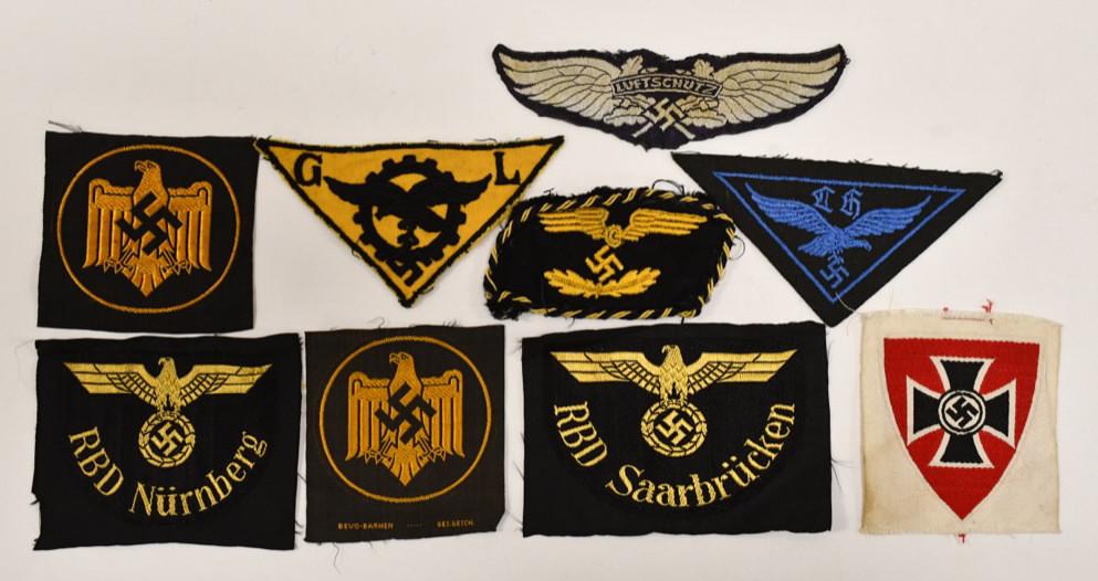 WWII German Political / Batallion Patches & More: Lot of WWII German insignia patches and more. Lot includes political , batallion patches, WWII German Police patch, and more. Items vary in age and condition. Display well. Lot includes 9 pieces. Larg