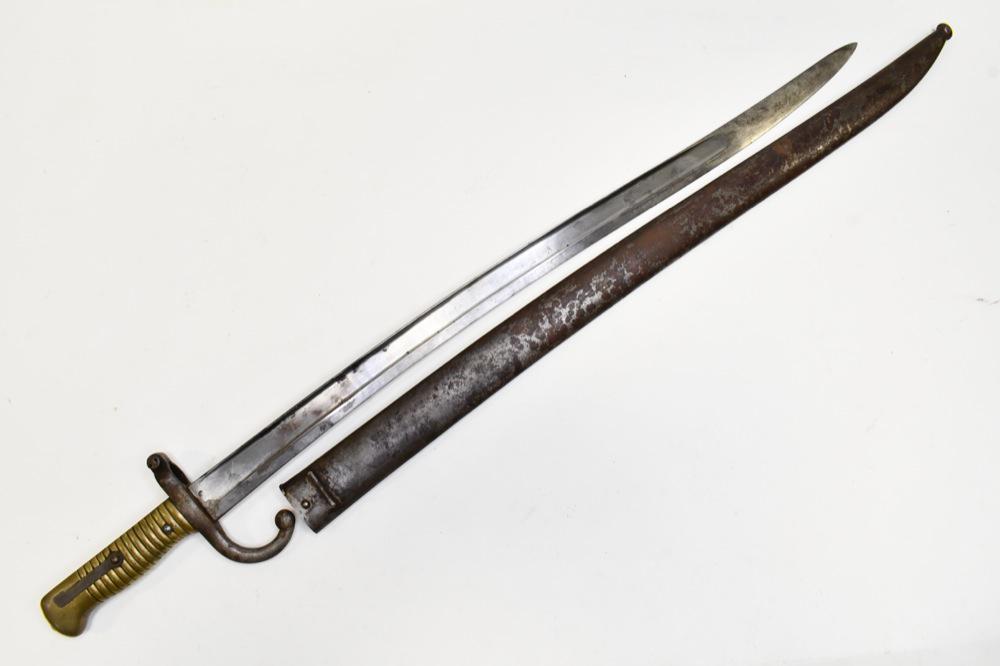 French Model 1866 Chassepot Yataghan Sword Bayonet: French model 1866 "Chassepot" sword bayonet with scabbard. Bayonet is in good condition with some pitting and wear from use and age. Scabbard has surface rust and wear. Blade guard is marked "P62793".