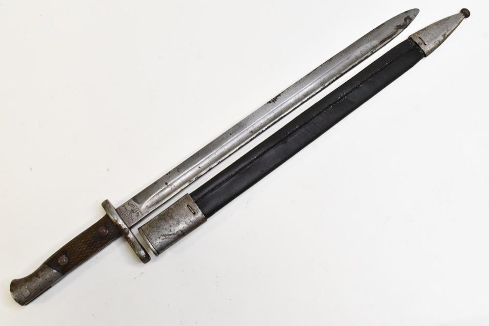 Spanish Model 1893 Mauser Bayonet w/ Scabbard: Spanish model 1893 Mauser bayonet with scabbard. Worn condition with dull blade and wear from use and age. Blade is marked " Artilleria Nacional Toledo" Overall it measures approximately 20-1/2" acros