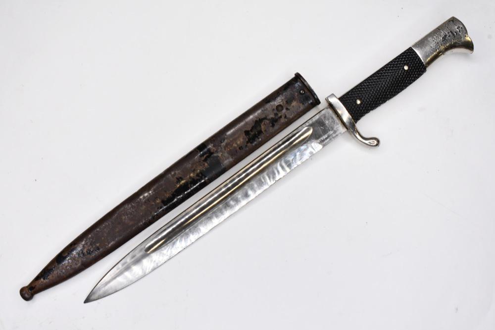 WWII German Dress Bayonet w/ Scabbard: WWII German dress bayonet with scabbard. Fair condition with plate loss and wear from use and age. Blade is loose. Blade is marked "Rich.Abr.Herder". Overall with scabbard it measures approximately 15