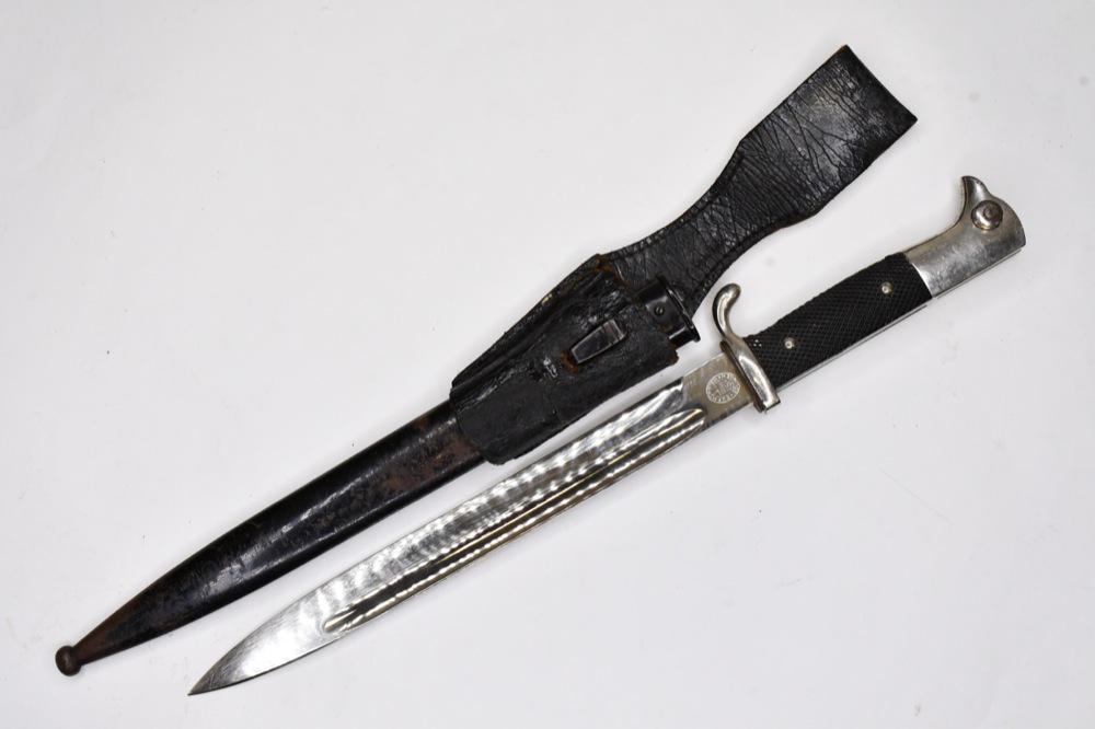WWII German Dress Bayonet w/ Scabbard & Frog: WWII German dress bayonet with scabbard and leather frog. Nice condition with wear from use and age. Blade is marked "F. Horster". Overall with scabbard it measures approximately 15-1/2" across. Blade