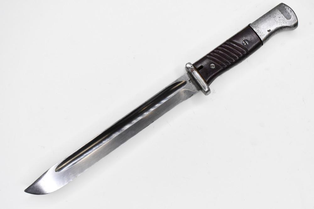 WWII German S84/98 K98 Mauser Bayonet: WWII German S84/98 Mauser BYM bayonet. Bayonet is in good condition with wear from use and age. Blade has been cleaned. It is marked " bym ' and '43". Overall it measures approximately 13-3/4" across.
