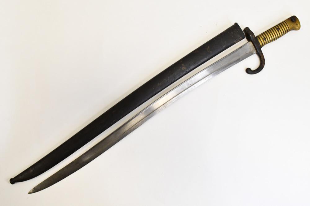 French Model 1866 Chassepot Yataghan Sword Bayonet: Original French model 1866 "Chassepot" sword bayonet with scabbard. Bayonet is in good condition with wear from use and age. Scabbard has surface rust and wear. Blade is etched on the back edge and da