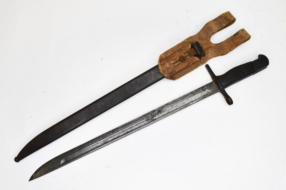 WWII Japanese Toyada Automatic Loom Works Bayonet: WWII Japanese bayonet with Toyada Automatic Loom Works markings and scabbard with frog. Good condition with wear from use and age. Blade does have pitting. Blade measures approximately 15 1/2" long, o