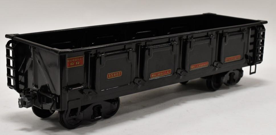 Buddy L Outdoor Railroad Side Dump Ballast Gondola: T-Reproduction Buddy L Outdoor Railroad side dump ballast gondola car. Decal reads #35407. Displays nicely with wear from storage and display. Overall measures approximately 21 1/2" long.