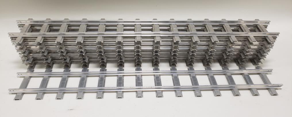 (9) Buddy "L" T-Reproductions Straight Track: T-Reproductions Buddy L outdoor railroad curved tracks. Nice condition with wear from use and age. Each track measures approximately 48" long.