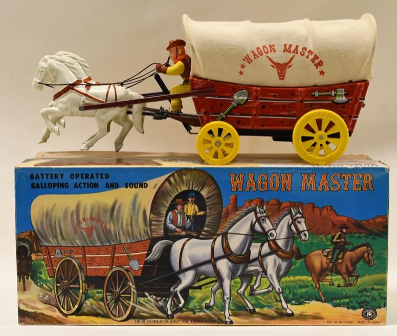 Modern Toys Tin Battery Op. Wagon Master: Nice Modern Toys tin battery operated wagon master in the box. The wagon is made of tin, and the rest is mostly plastic. Displays nicely with light wear from age. Measures approximately 18" long.