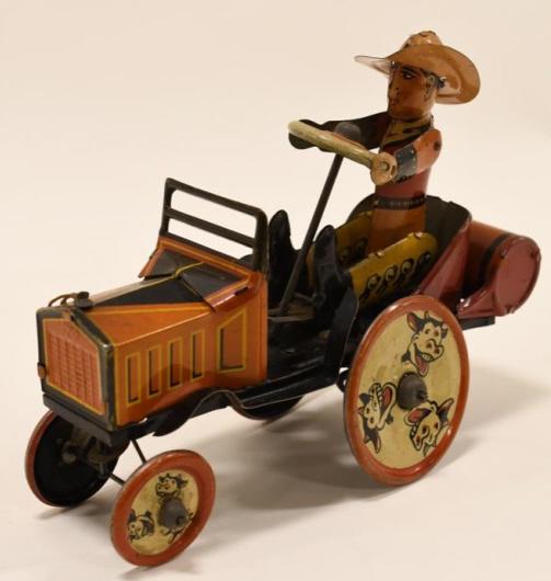 Marx Tin Litho Windup Whoopee Cowboy Car: Nice Marx tin litho windup Whoopee Cowboy car. Has paint loss and wear from age and play. The windup works, but needs some help. Displays nicely. Measures approximately 8" long.