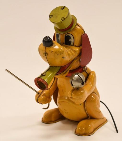 Linemar Tin Litho Windup Pluto The Drum Major: Nice Linemar Toys tin litho windup Pluto The Drum Major. Displays nicely with some paint loss and wear from play and age. The toy is missing the key, so it is untested. Measures approximately 6" tall.