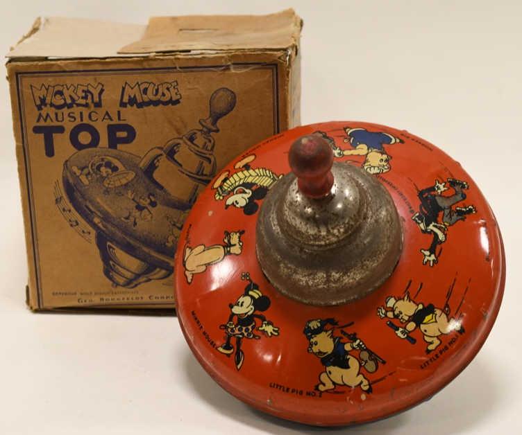 Walt Disney Mickey Mouse Musical Top Geo Borgfeldt: Nice Walt Disney Mickey Mouse Musical Top Geo. Borgfeldt Corporation. Comes with the box. Box has some replacement flaps. The box has wear and tear from storage and age. The top has some paint loss an