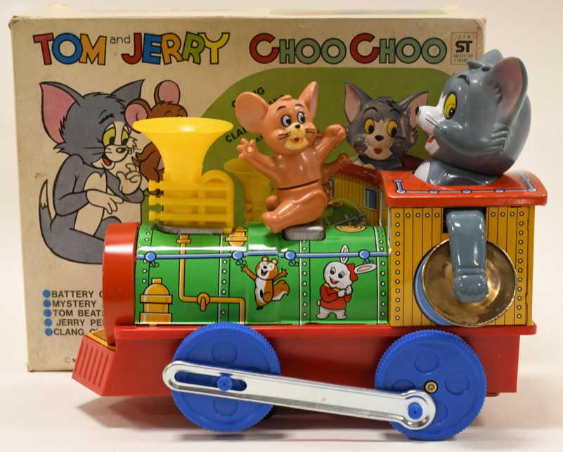 Modern Toys Tin Battery Op Tom and Jerry Choo Choo: Nice Modern Toys tin litho battery operated Tom and Jerry Choo Choo train with the box. Displays nicely with light wear from age and display. Train is made of tin, and Tom + Jerry are made of plastic.