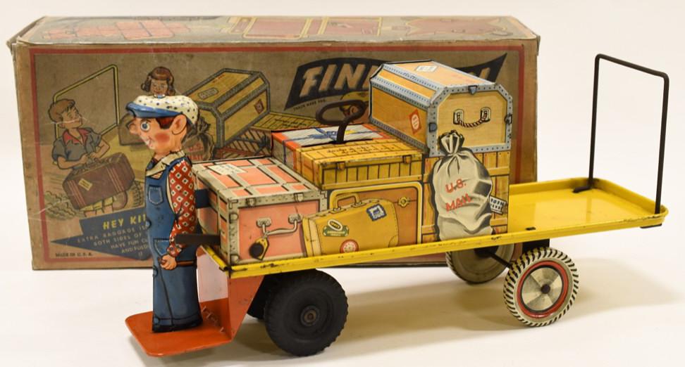 Unique Art Tin Windup Finnegan Luggage Carrier: Nice Unique Art tin litho windup Finnegan luggage carrier with reproduction box. Displays nicely with some paint loss and wear from play and age. Windup mechanism works. Measures approximately 13 1/2"