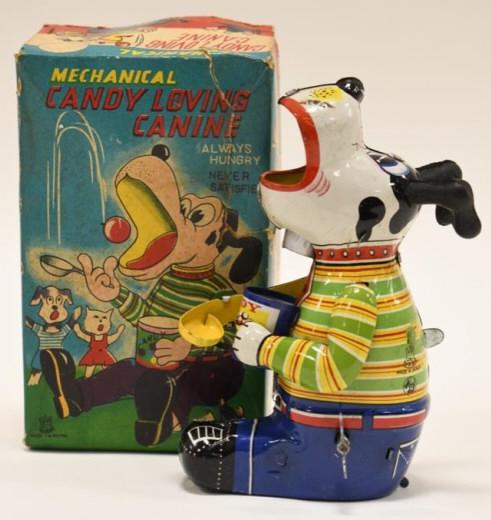 T.P.S. Tin Litho Windup Candy Loving Canine: T.P.S. Japan tin litho windup candy loving canine toy in box. Windup mechanism works. Box displays nicely with great color and graphics, has some wear and tear from age. The dog is in nice condition w