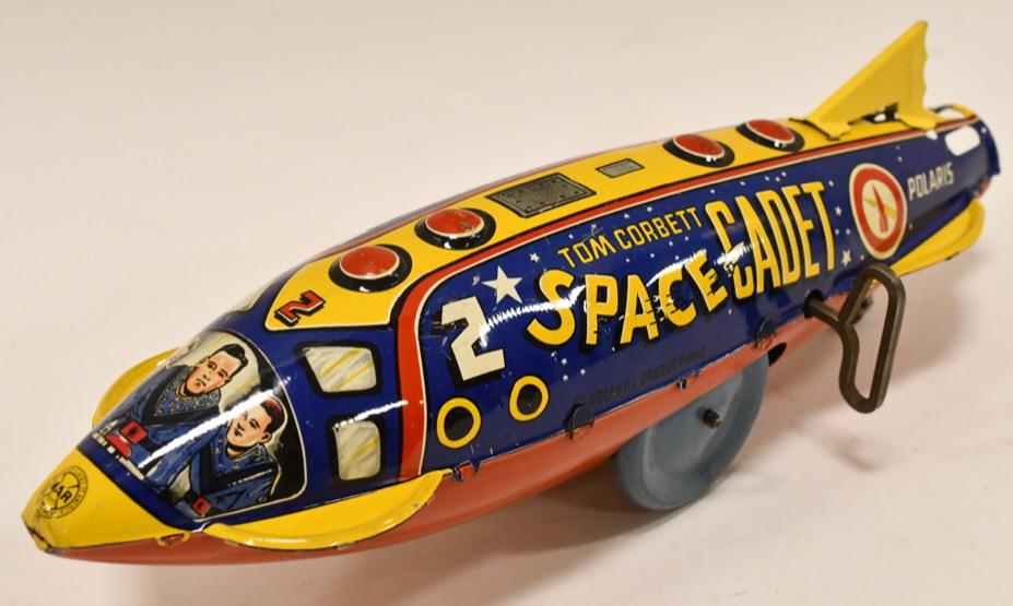 Marx Tin Litho Windup Tom Corbett Space Cadet Ship: Marx tin litho windup Tom Corbett Space Cadet Polaris space ship. Displays very nicely with some light paint loss and wear from play and age. The windup mechanism is in working order. Nice example of 