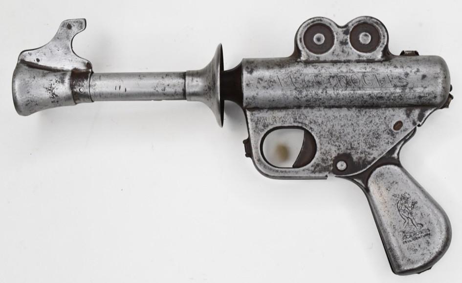 Daisy MFG. Co. Buck Rogers Space Ray Pop Gun: Scarce Daisy MFG. Co. 25th Century space ray pop gun. When the gun is cocked and the trigger is pulled the gun makes a popping noise. Displays very nicely with wear from age and use. Measures approxim