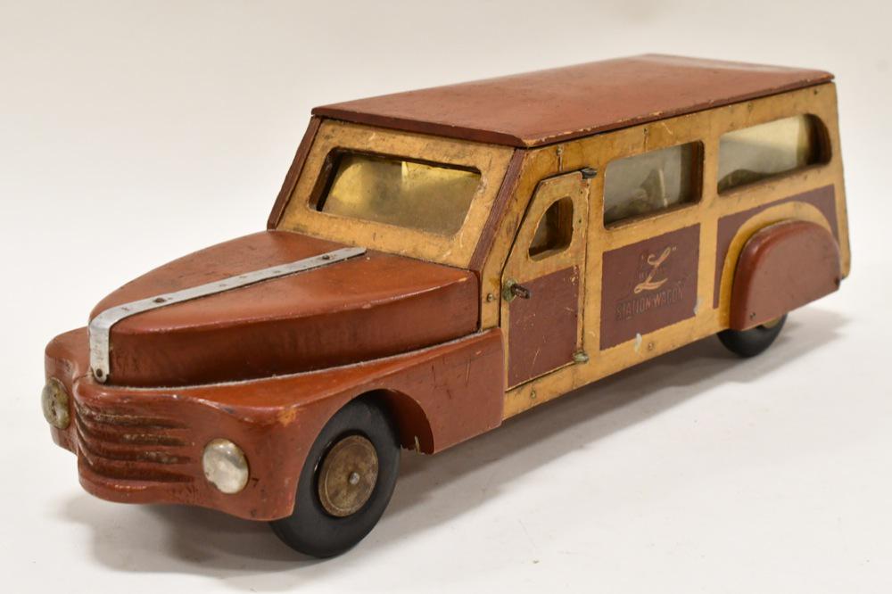 Buddy L Wood Toys Station Wagon Car: Buddy L Wood Toys WWll Era Sation Wagon Car. Displays nicely with a great look. The plastic windows are cracked on the passenger side. Measures approximately 18 1/2" long