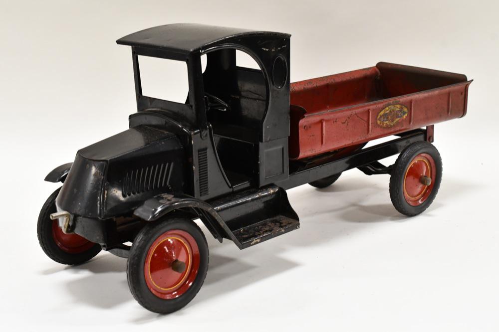 Original American National Mack Bulldog Dump Truck: Original American National Mack Bulldog dump truck. Displays nicely with the crank dump. Does have some paint loss and wear from play and age. Measures approximately 27" long.