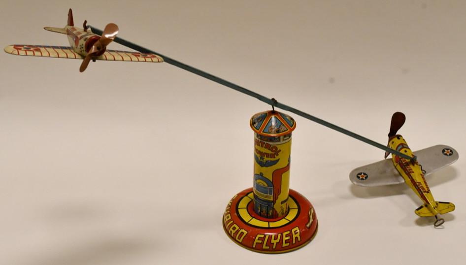 Marx Tin Litho Windup Sky Bird Flyer: Marx tin litho windup Sky Bird Flyer toy. Displays nicely with great color. Nice condition with some paint loss and wear form play and age. The windup on the plane works. Overall measures approximatel