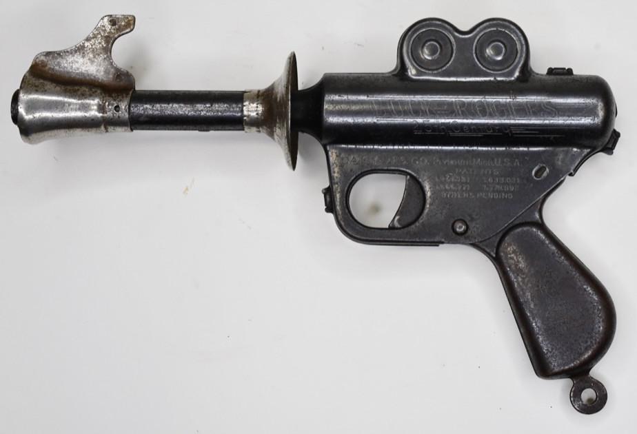 Daisy MFG. Co. Buck Rogers Space Ray Pop Gun: Daisy MFG. Co. 25th Century space ray pop gun. When the gun is cocked and the trigger is pulled the gun makes a popping noise. Displays very nicely with wear from age and use. Measures approximately 9