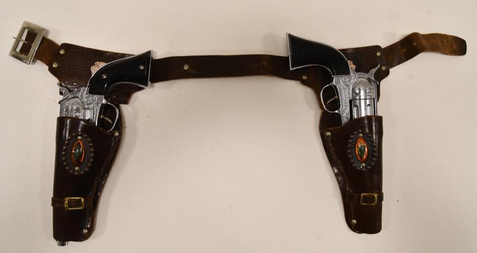 Hubley Ric-O-Shay .45 Cap Gun Set w/ Holster: Nice Hubley Ric-O-Shay . 45 cap gun set with leather holster. The guns display well with revolving cylinder and slick black grips. Both of the triggers work. The set is in nice condition with wear fro