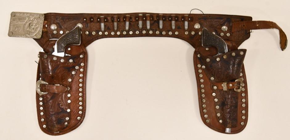 Roy Rogers and Trigger Cap Gun Set w/ Holster: Beautiful Roy Rogers and Trigger cap gun set with leather holster. The cap guns are marked Geo Schmidt Mfg. Company. The triggers work on the cap guns. The belt displays nicely with a Roy Rogers and T