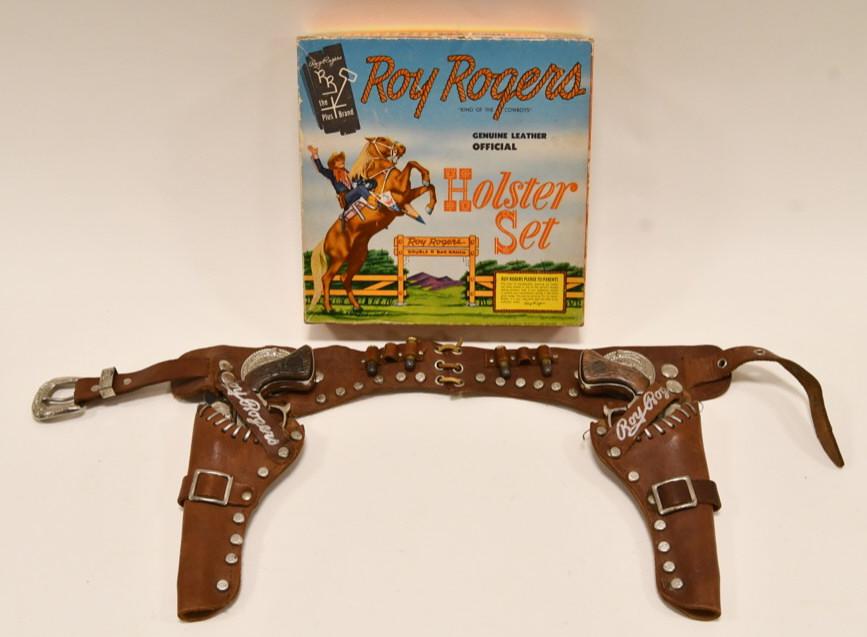Roy Rogers Cap Gun Set with Holster in Box: Very nice Roy Rogers "King of the Cowboys" geniune leather official holster set. Comes with the box. The box displays very nicely with great color. The cap gun set is in nice condition. Both of the tr