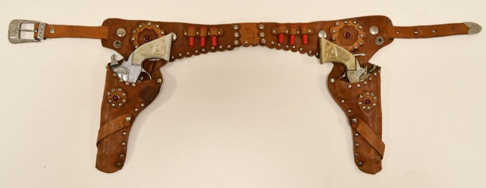 Kilgore Roy Rogers Cap Gun Set with Holster: Very nice Kilgore Roy Rogers cap gun set with official Roy Rogers leather holster. Both of the triggers work on the cap guns. The guns display well with Roy Rogers horse Trigger on them. The holster s