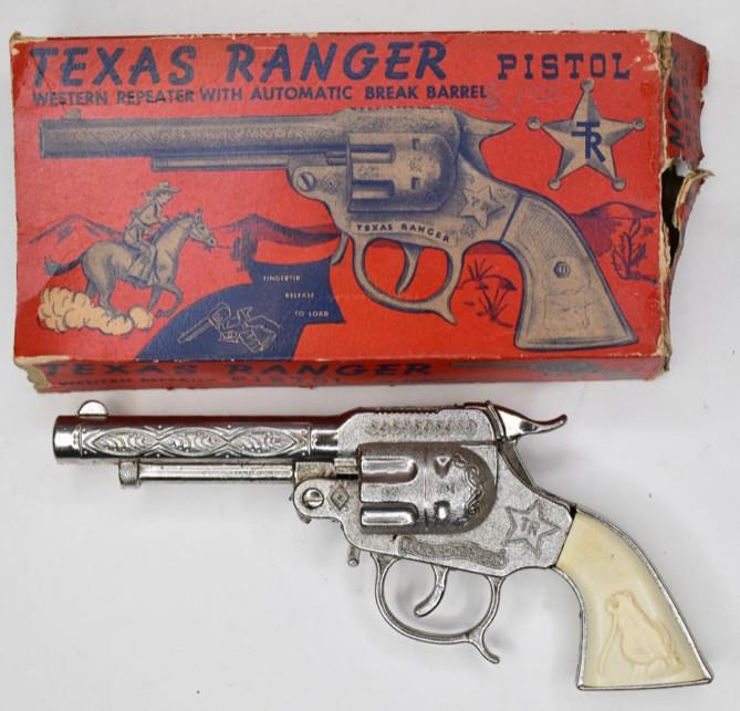 Leslie-Henry Texas Ranger Cap Gun Pistol: Leslie-Henry Texas Ranger cap gun pistol with the original box. The box is missing the flaps on one end. The cap gun is in nice condition with light wear from age. The trigger works. Gun measures appr