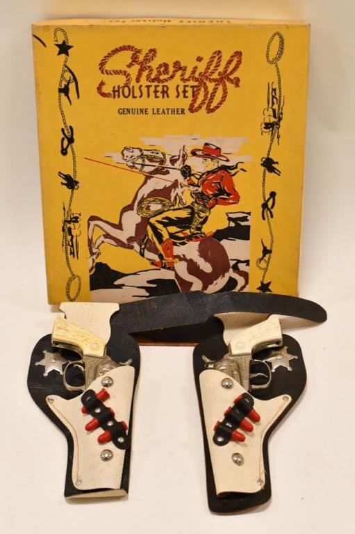 Arrow Sales Sheriff Holster Set w/ Cap Guns: Arrow Sales Sheriff holster set. Set includes (2) Hubley Rodeo cap gun pistols and a sheriff genuine leather double cap gun holster. The one cap guns trigger needs some work. The set displays well wit