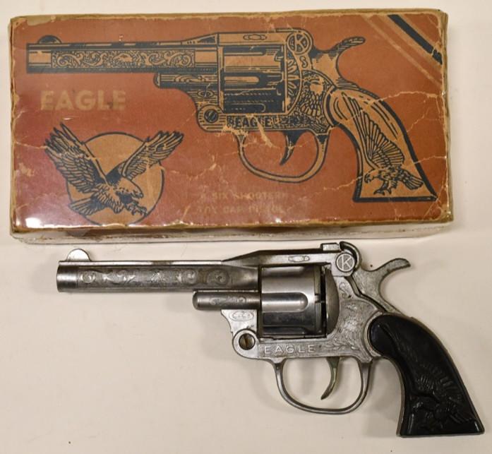 Kilgore Eagle Six Shooter Cap Gun Pistol: Kilgore Eagle six shooter cap pistol with the original box. The gun displays well with wear from age and play. The box has some veining and wear from storage and age. The trigger works. Gun measures a