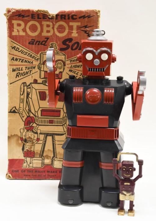 Marx Electric Battery Operated Robot and Son: Nice vintage Marx electric robot and son with the original box. Complete with the Robot and Son. Robot is untested. Box has some water damage and staining. Robot is in nice condition with some light w