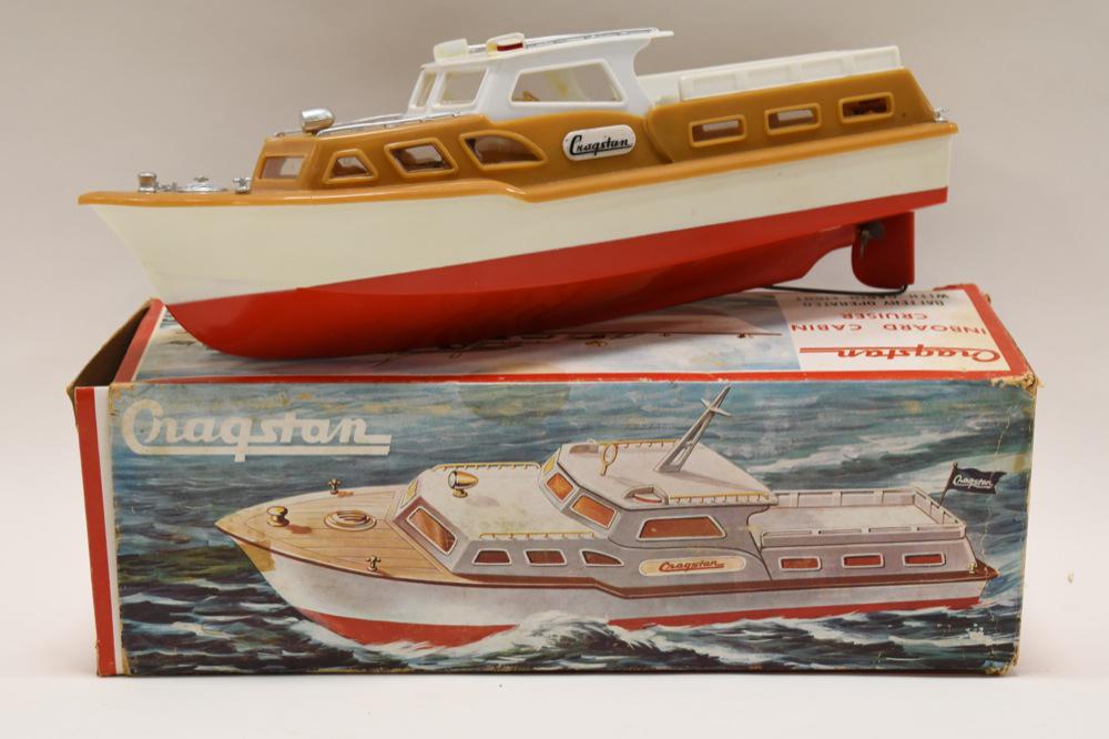Cragstan Battery Op. Inboard Cabin Cruiser: Cragstan plastic battery operated inboard cabin cruise tiwh the box. the boat is missing the flag on top. The box has wear and tear. Displays nicely with wear from age and play. Measures approximately