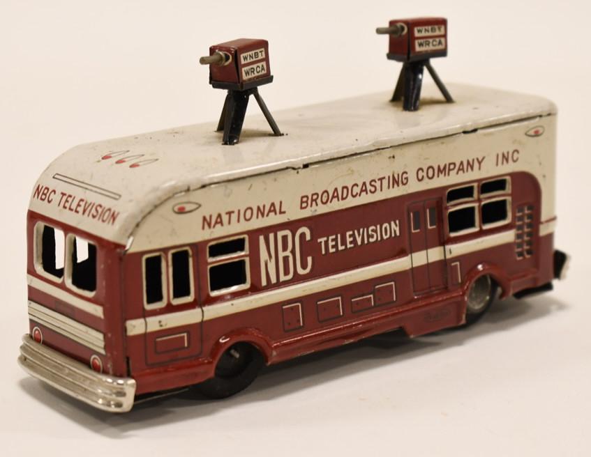 Japan Tin Litho Friction NBC Television News Bus: Japan tin litho friction NBC Television News Bus. Has paint loss and wear form pla and age. The friciton works. Displays nicely. Has some dents / dings. It is missing 1 hubcap. Measures approximately
