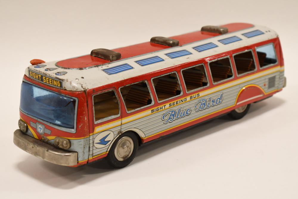 Modern Toys Tin Litho Blue Bird Sight Seeing Bus: Modern Toys tin litho Blue Bird sight seeing bus. The friction does not work. The windshield has a crack in it. Good condition with paint loss and wear from play and age. Measures approximately 14" lo