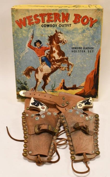 Western Boy Cowboy Outfit w/ Texan Jr. Cap Guns: Western Boy Cowboy Outfit set. The set includes (2) Hubley Texan Jr. cap gun pistols and a double leather cap gun holster. The cap guns are in nice condition, both have working triggers. The holster h