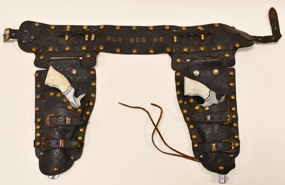 Kilgore Roy Rogers Cap Gun Set w/ Holster: Kilgore Roy Rogers paper cap gun set with Roy Rogers leather holster. The cap guns display well with revolving cylinders. The triggers work. They have light corrosion and wear from age and play. The h