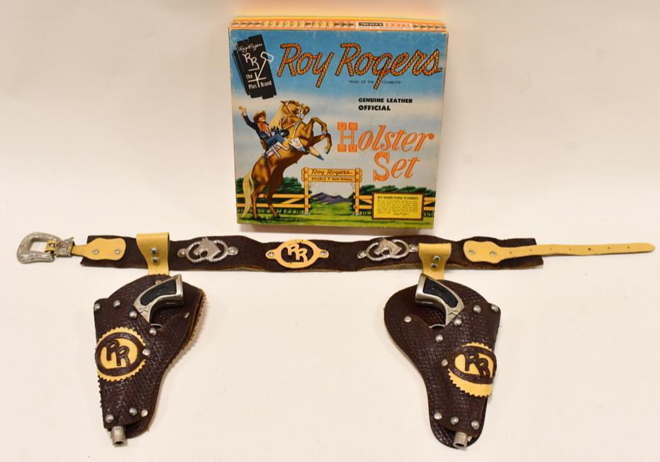 Buzz Henry Roy Rogers Cap Gun Holster Set: Buzz Henry Roy Rogers cap gun set with Roy Rogers holster and box. The cap guns are in nice condition with some wear from play and age. Both triggers work. The Roy Rogers holster displays well with li