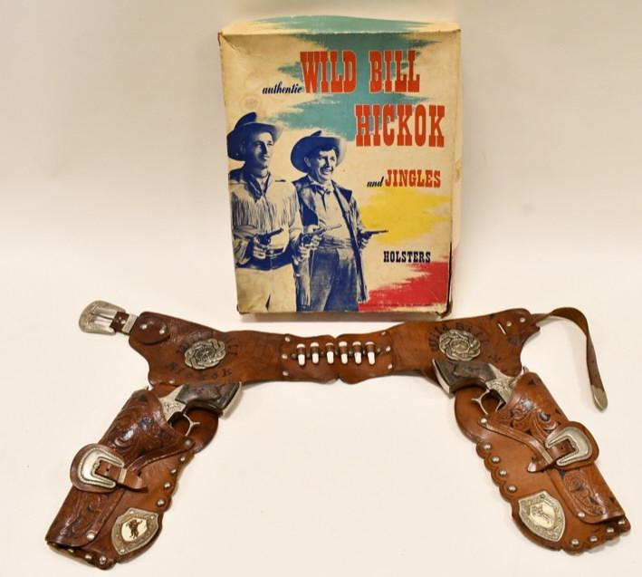 Leslie-Henry Wild Bill Hickok Cap Gun Holster Set: Leslie-Henry Wild Bill Hickok cap gun holster set with the box. The cap guns have some light wear, but display nicely with Wild Bill Hickok grips. Both triggers work, but the one sticks. The holsters