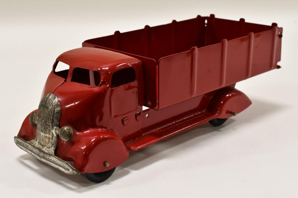 Marx Studebaker COE Stake Bed Truck: Restored Marx pressed steel Studebaker COE stake bed truck. Displays nicely with professional restoration. Nice condition with light wear from storage and display. Measures approximately 12 1/2" long.