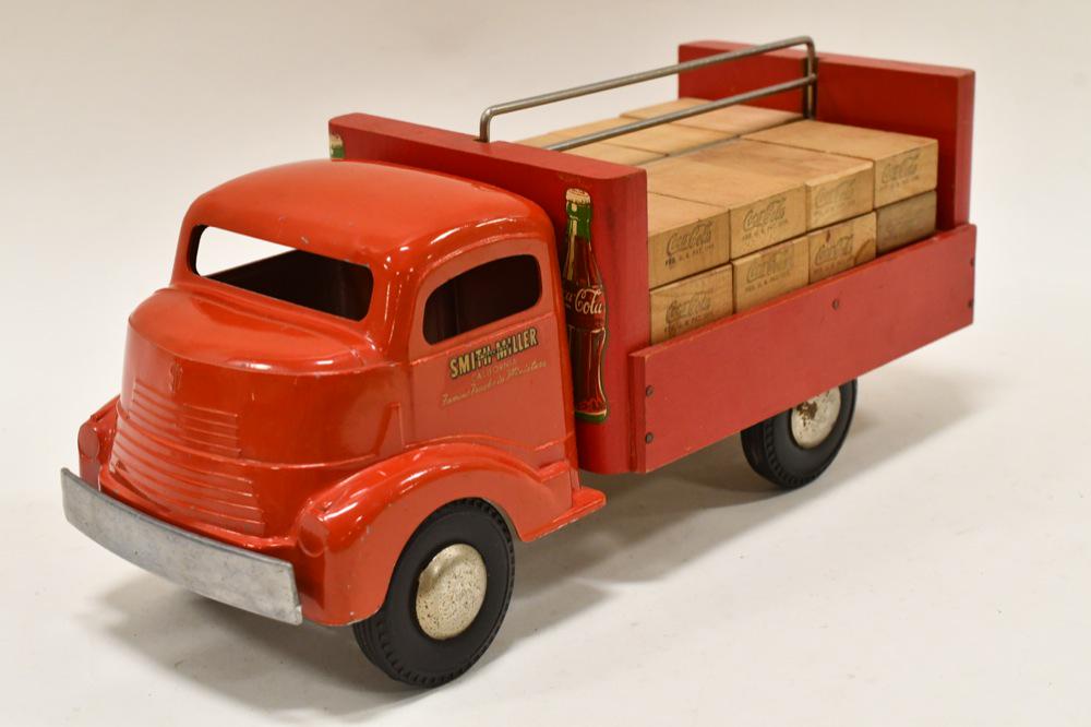 Smith Miller GMC Coca-Cola Delivery Truck: Smith Miller GMC Coca-Cola delivery truck. Displays nicely with Coca-Cola decals and wooden Coca-Cola crates. Nice condition. Measures approximately 13 1/2" long.