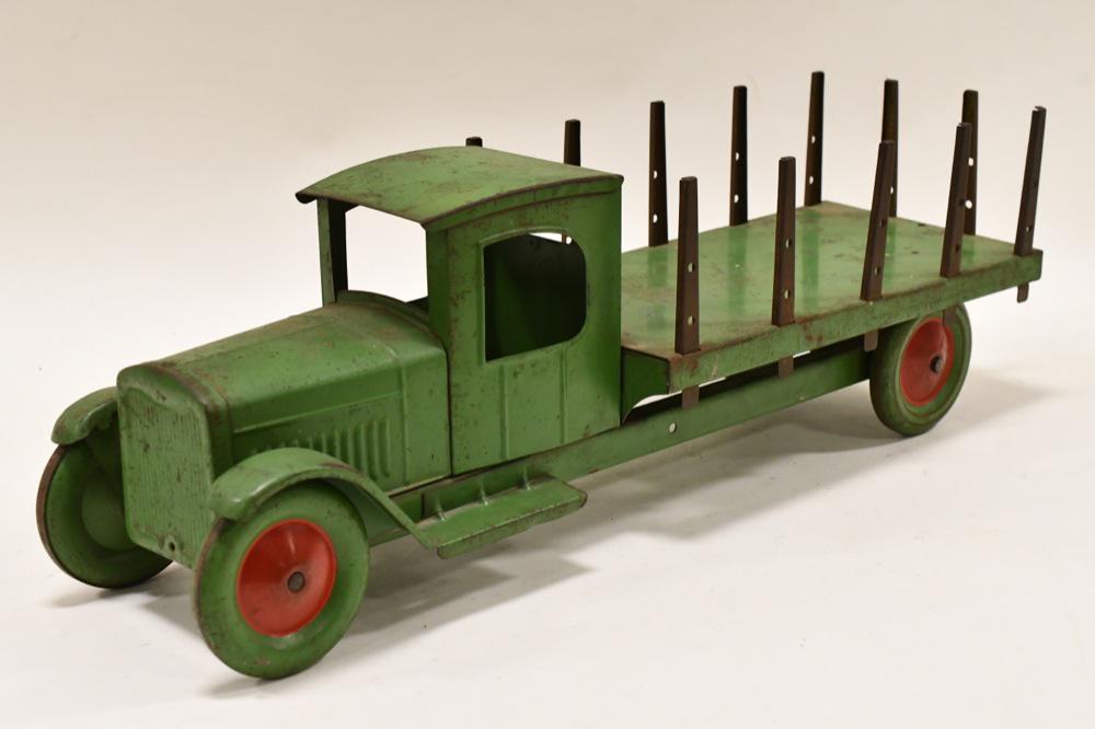 Original Steelcraft Stake Bed Truck: Original Steelcraft stake bed truck. Displays nicely with some paint loss and wear from play and age. Measures approximately 22" long.