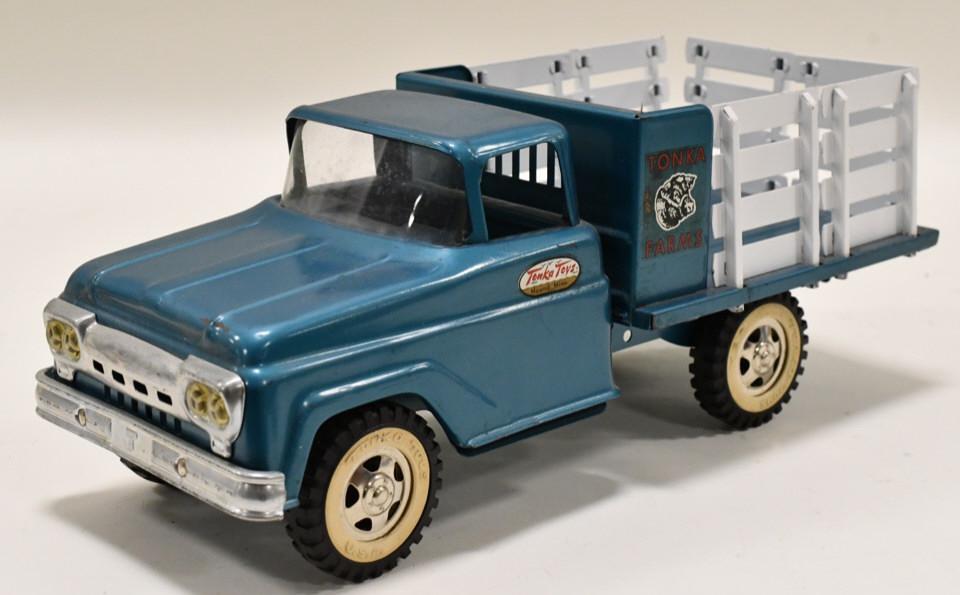 Tonka Farms Stake Truck: Original Tonka Farms stake truck. Displays nicely with soe paint loss and wear from play and age. Measures approximately 14" long.