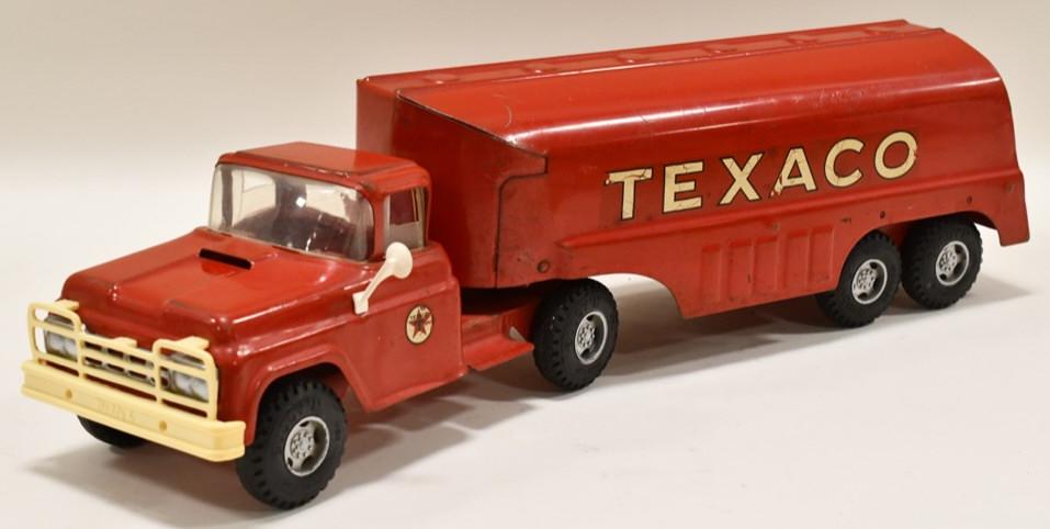 Buddy L Texaco Tanker Truck and Trailer: Original Buddy L Texaco tanker truck and trailer. The truck has spring suspension on the front. Displays nicely with some paint loss and wear from play and age. Measures approximately 24" long.