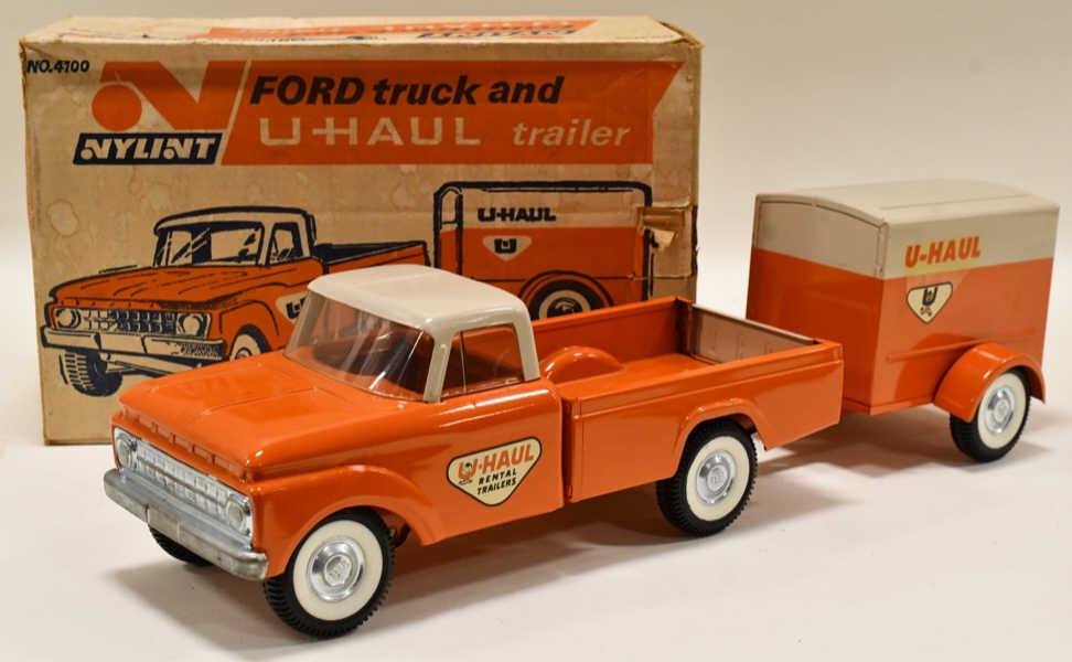 Nylint Ford Pickup Truck & U-Haul Trailer No. 4100: Nylint Ford pickup truck with U-Haul trailer no. 4100 with the original box. The truck and trailer are in nice condition with light rubs and wear from the box. The truck has front spring suspension. D