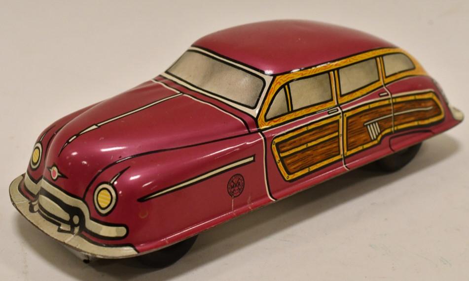 Marx Tin Litho Windup Woody Station Wagon: Marx tin litho windup Woody Station Wagon. Displays nicely with light wear from play and age. Windup mechanism works. Measures approximately 7 1/2" long.